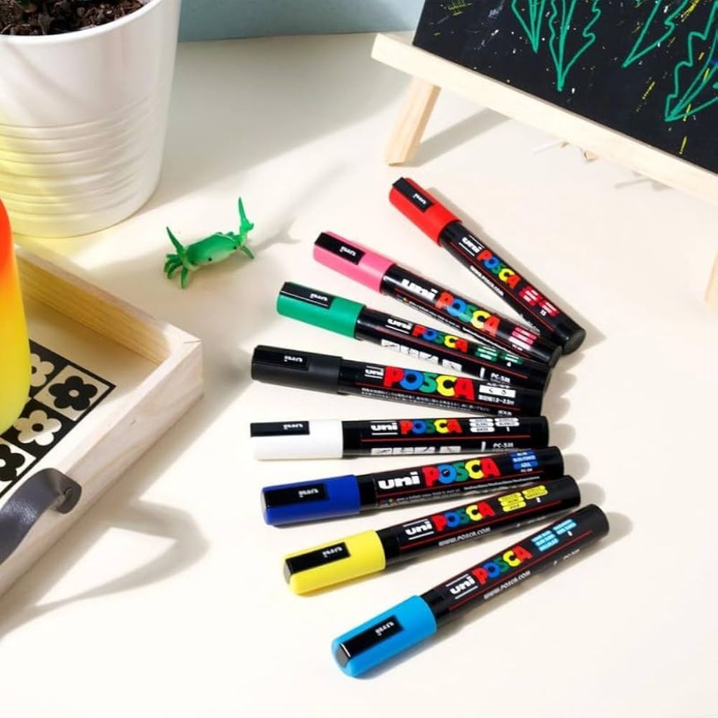 Uni-ball Uni Posca PC-3M Paint Markers displayed on a surface