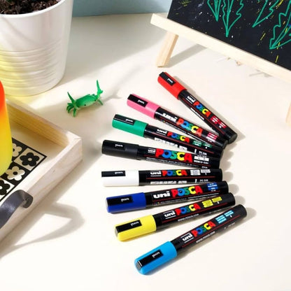 Uni-ball Uni Posca PC-3M Paint Markers displayed on a surface