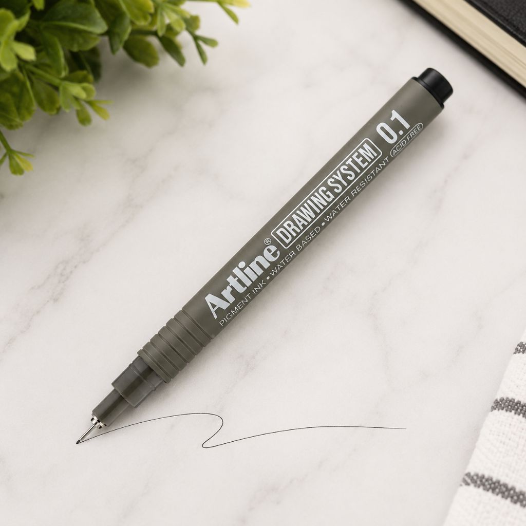 Artline Premium Drawing System Pen 0.1 in Black on a marble surface